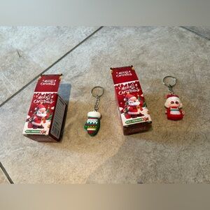 2 Merry Christmas doll pendant. Open box.